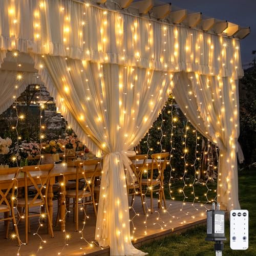 JMEXSUSS 900 LED Outdoor Christmas Curtain Lights, 9.5x29.5ft Christmas Lights Plug in with Remote, Twinkle Hanging String Light for Bedroom Wall Wedding Backdrop Window Gazebo Decor, Warm White